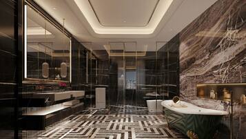 A modern bathroom with a marble wall, a freestanding bathtub, and a geometric patterned floor.
