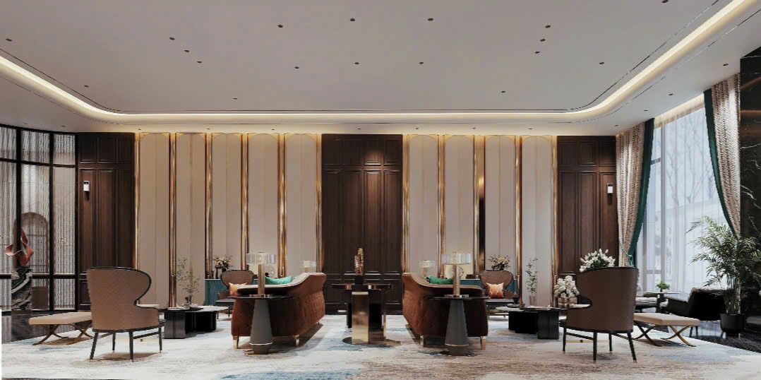 Een moderne hotellobby met een centrale zithoek, grote ramen en decoratieve panelen.