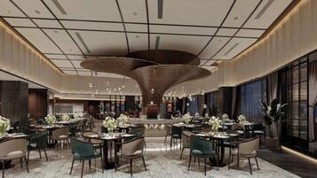 A spacious hotel lobby with a central bar area, multiple seating arrangements, and a modern ceiling design.