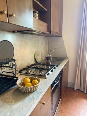 Apartment, 3 Bedrooms, Kitchen, Garden View | Private kitchen | Fridge, oven, stovetop, dishwasher - I Fontanili (Montalto di Castro)