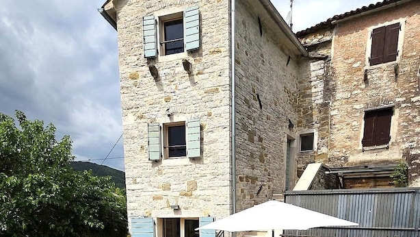 A stone building with a pool, outdoor seating, and a staircase leading to a second floor. - CROGO Casa Gradinje-Holiday Home-Istria-Motovun (Gradinje)