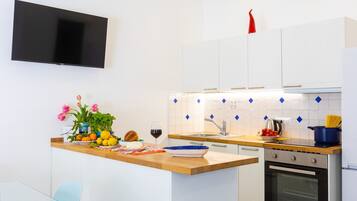 Deluxe Apartment, Sea View | Private kitchen | Fridge, oven, stovetop, dishwasher