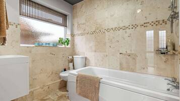 Shower, hair dryer, towels, shampoo