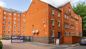 A multi-story brick building with a sign reading 'PARK COUTT.' - For Students Only - Park Court in Lincoln - Campus Accommodation (Lincoln)