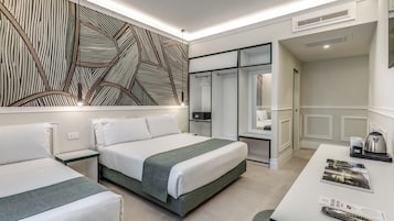 Deluxe Triple Room | In-room safe, desk, laptop workspace, blackout drapes