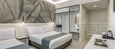 Deluxe Triple Room | In-room safe, desk, laptop workspace, blackout drapes