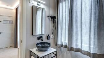 Deluxe Single Room | Bathroom | Shower, hair dryer, slippers, towels