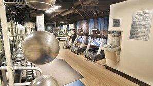 A fitness studio with exercise equipment, a water station, and a sign with rules. - Steps to Keystone Weddings, Gondola, Dining! 3 Hot Tubs, Pool, Elevator (Keystone)