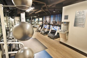 A fitness studio with exercise equipment, a water station, and a sign with rules. - Steps to Keystone Weddings, Gondola, Dining! 3 Hot Tubs, Pool, Elevator (Keystone)