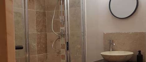 Shower, hair dryer, towels, soap