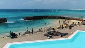 A pool area with a view of the ocean and beach. - Terrace with sea views! #Amazing sea views! (Santa Maria)