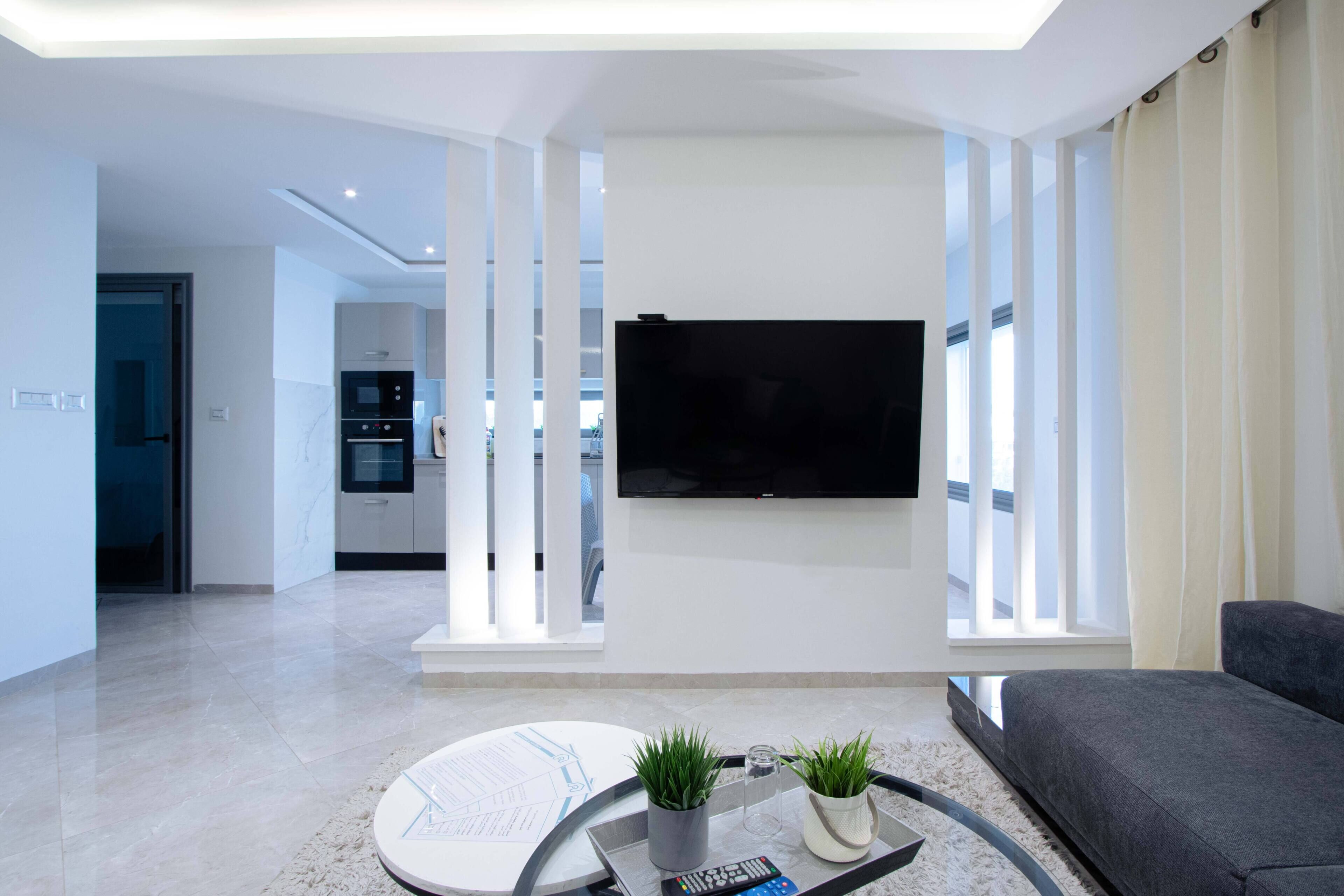 Departamento Deluxe, vista a la ciudad | Área de sala de estar