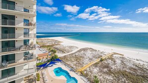A beachfront hotel with a pool, beach access, and ocean views. - Phoenix East 1011 3 Bedroom Condo (Orange Beach)