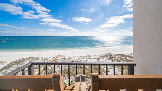 A balcony with a view of a beach and ocean. - Phoenix East 1011 3 Bedroom Condo (Orange Beach)