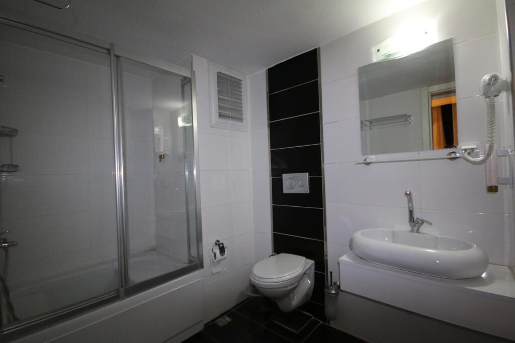 Basic Double Room, Balcony, City View | Bathroom | Shower, hair dryer, towels, soap