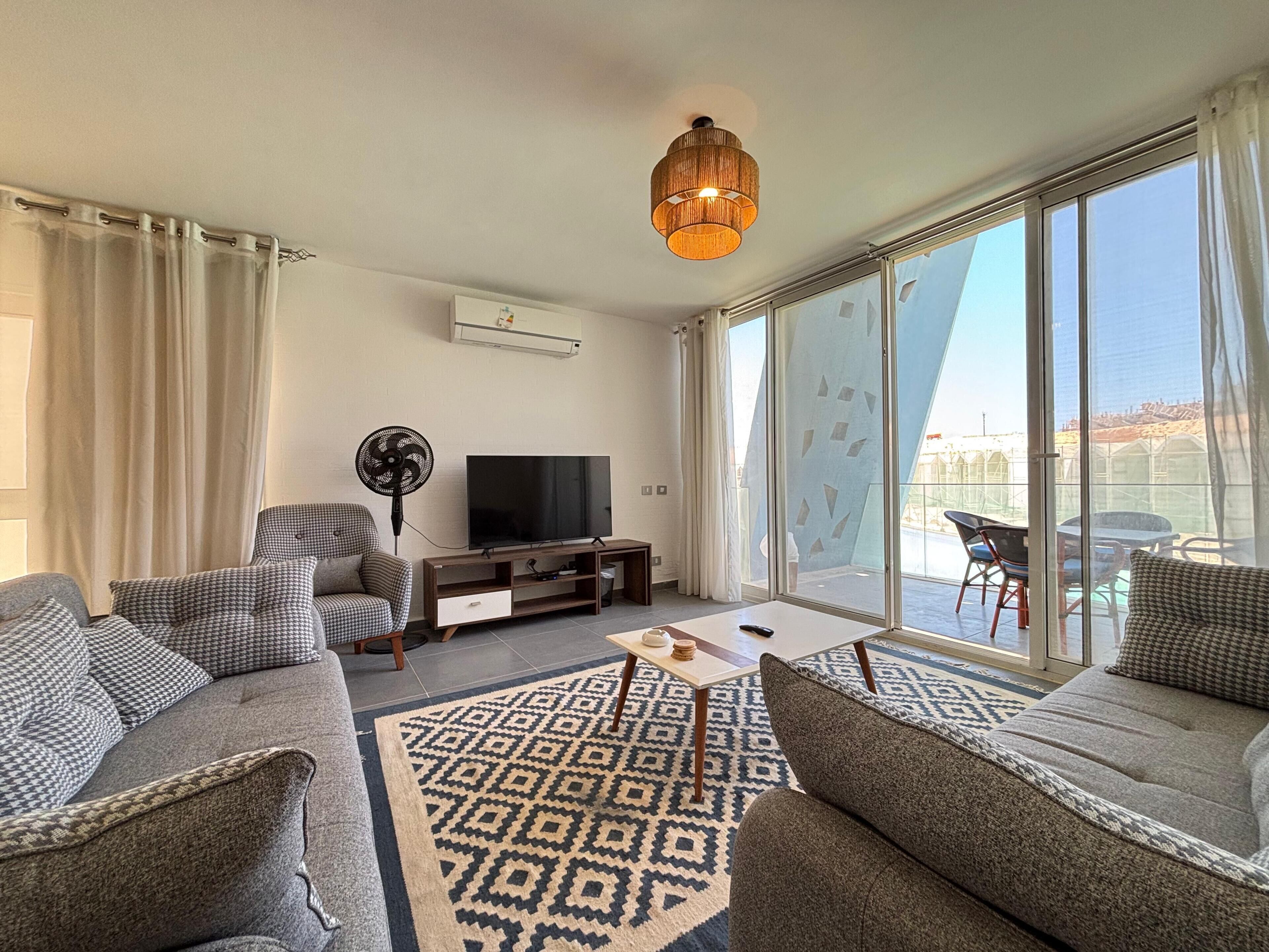Chalet, 3 Bedrooms, Lagoon View | Living area | Flat-screen TV