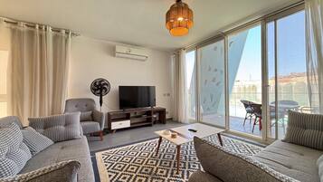 Chalet, 3 Bedrooms, Lagoon View | Living area | Flat-screen TV