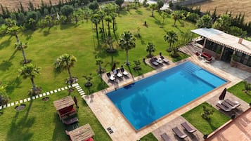 Outdoor pool, free pool cabanas, pool umbrellas