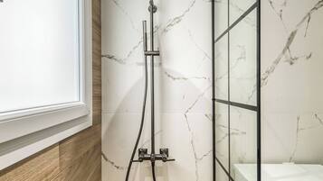 Shower, hair dryer, towels, soap