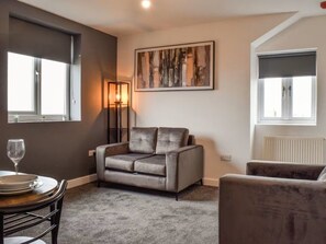 Appartement Signature, vue ville | Coin séjour
