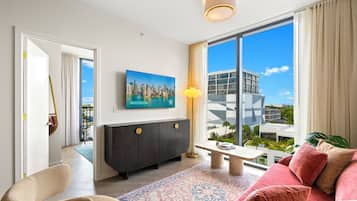 Apartment, 2 Bedrooms, City View | Living area | 50-inch Smart TV with cable channels