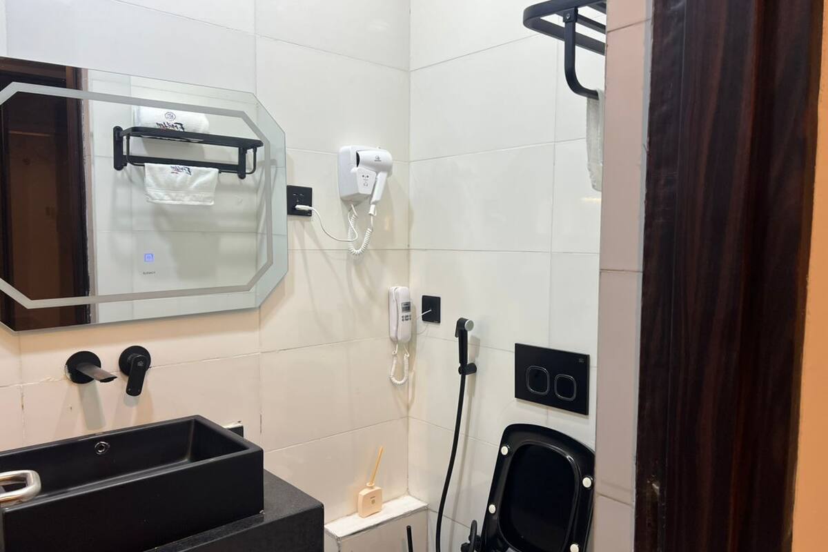 Twin Room, City View | Bathroom | Hair dryer, towels, soap, shampoo