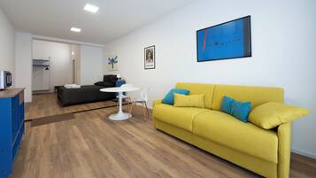 Standard Room, 1 Queen Bed with Sofa bed, Microwave | Living area