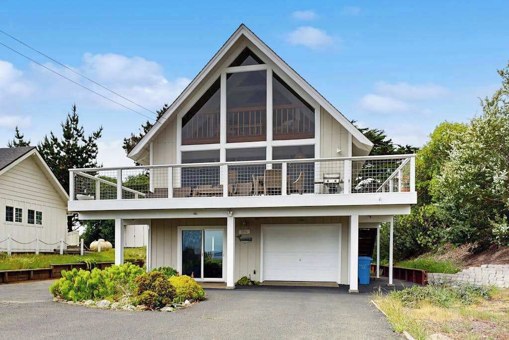 Welcome to your Bodega Bay coastal retreat — a charming A-frame with upper balcony, private garage, and lush landscaping just minutes from the harbor.