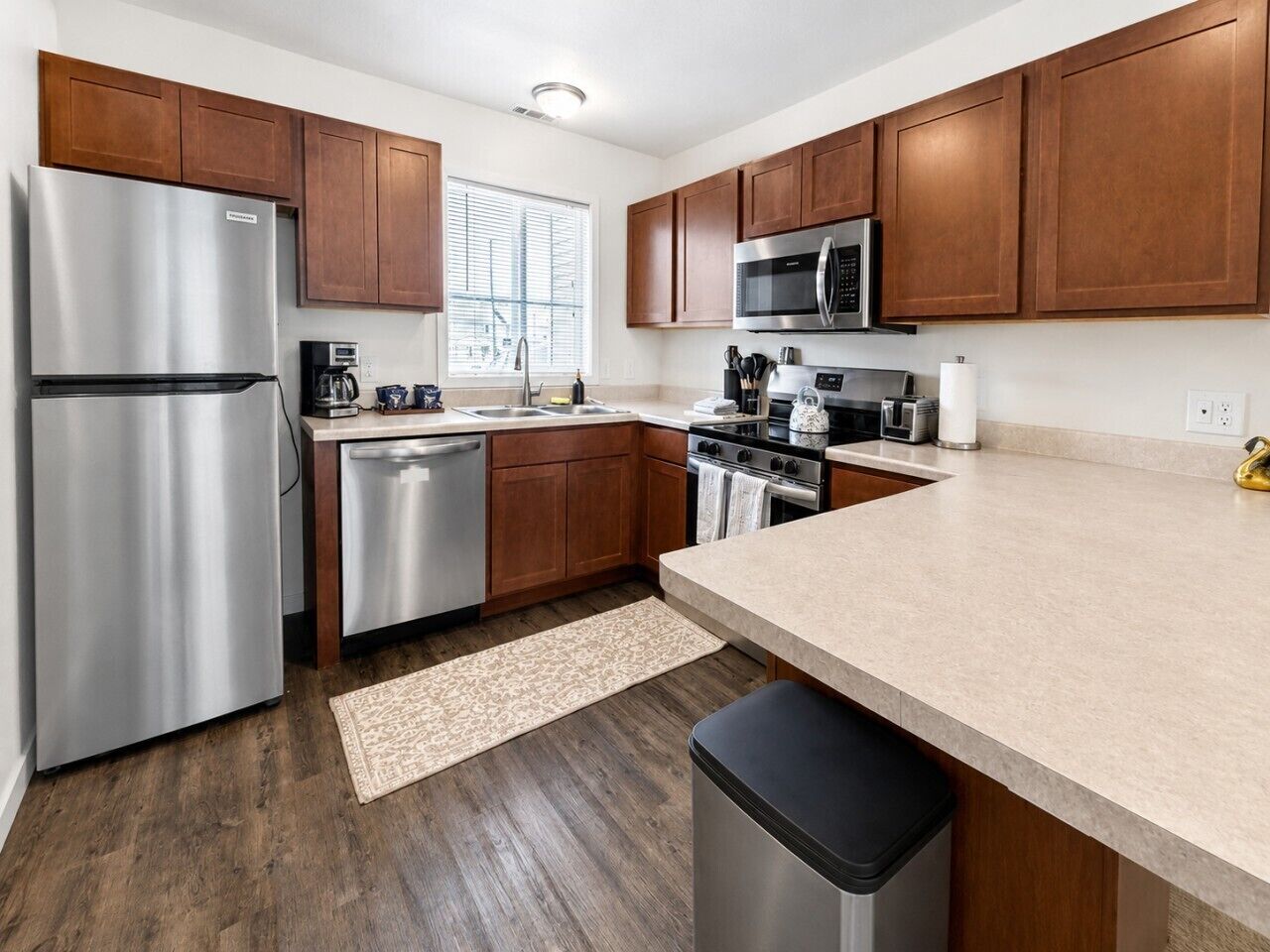 Fridge, stovetop, dishwasher, coffee/tea maker