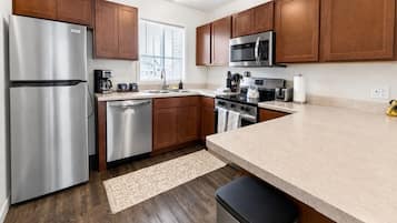 Fridge, stovetop, dishwasher, coffee/tea maker