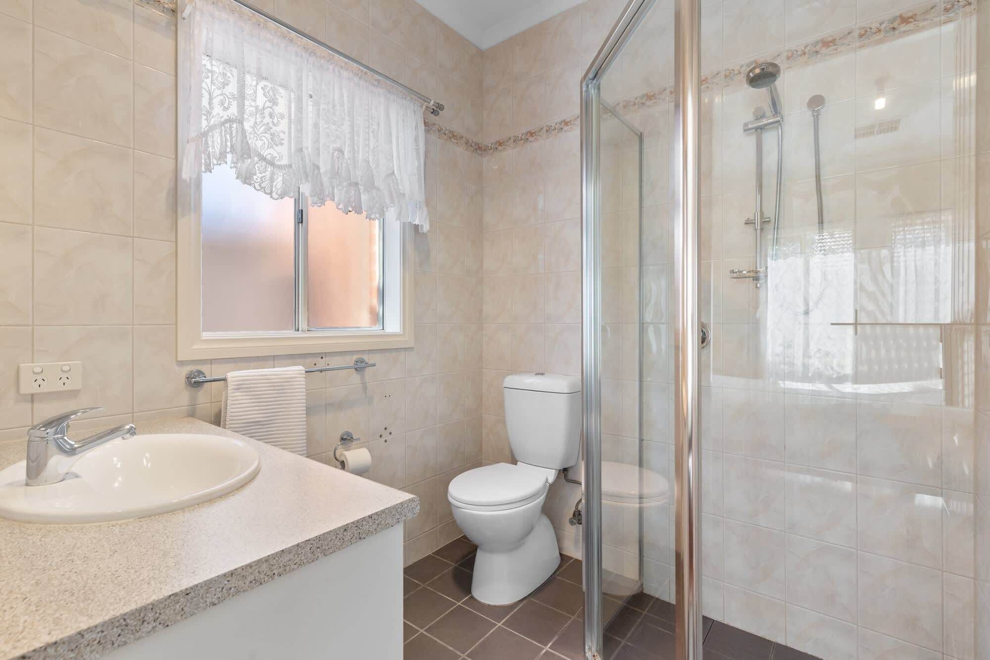Shower, hair dryer, towels, shampoo