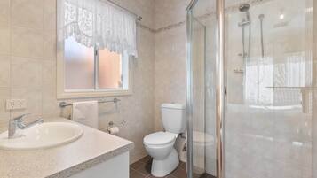 Shower, hair dryer, towels, shampoo