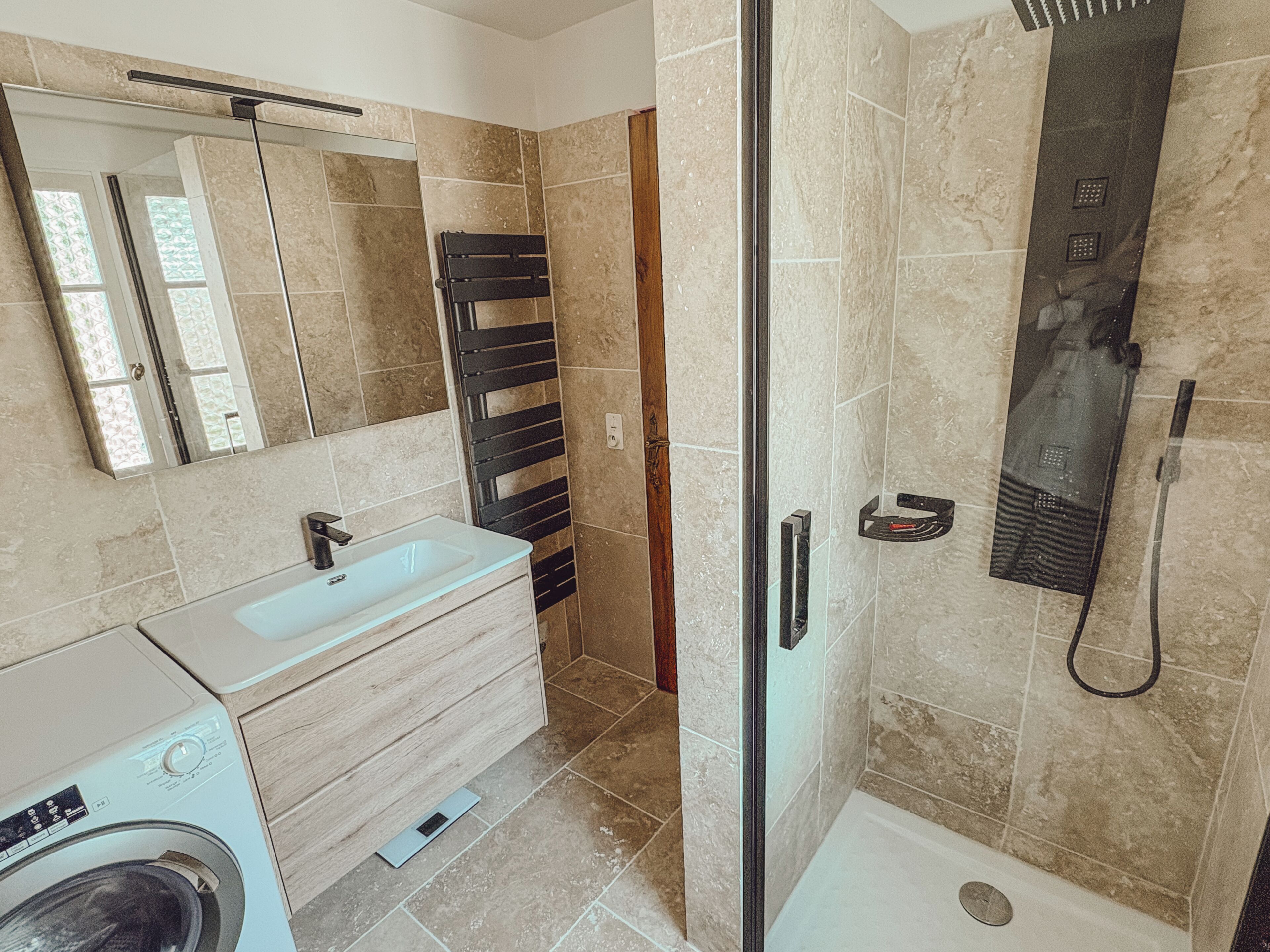 Shower, hair dryer, towels, toilet paper