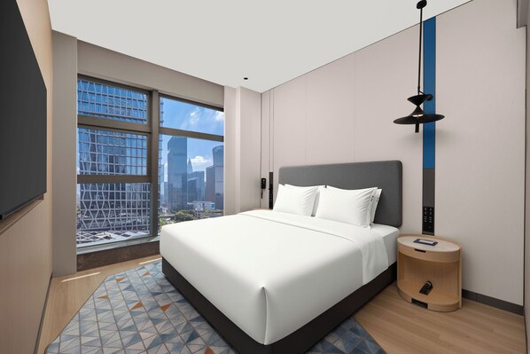 A modern hotel room with a large bed, a view of the cityscape, a round side table, and a wall-mounted light fixture. - Holiday Inn Express Shenzhen Bay By Ihg (Shenzhen)