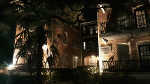 A multi-story building with a sign reading 'Warwick Apartments.' - Cozy Vintage Studio Close To Downtown (Mobile)