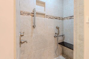 Shower, hair dryer, towels, shampoo