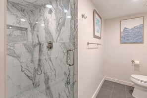 Shower, hair dryer, towels, shampoo