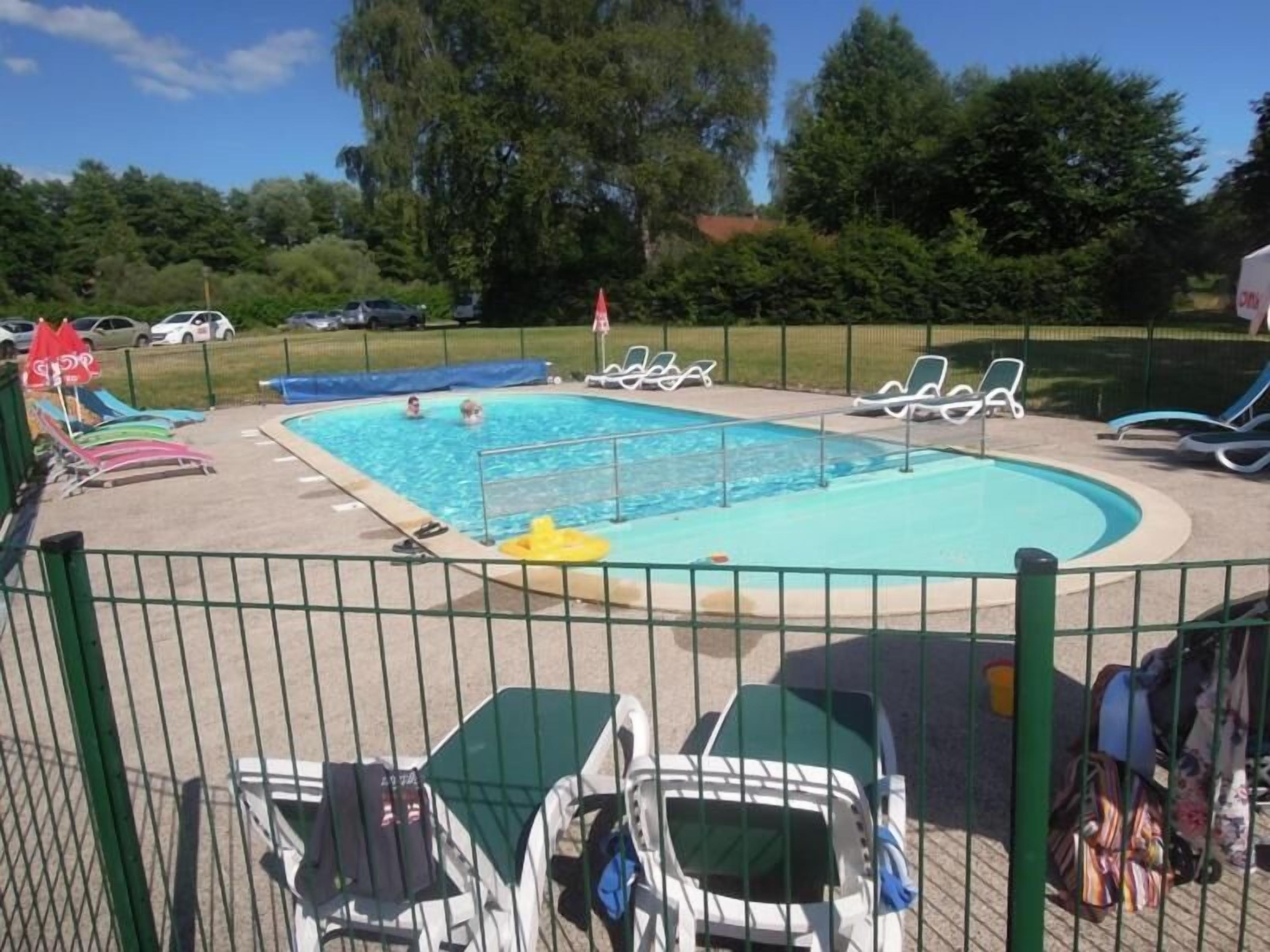 Seasonal outdoor pool, open 10:00 AM to 8:00 PM, pool umbrellas