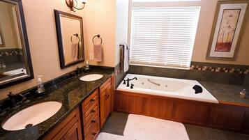 Jetted tub, hair dryer, towels, soap