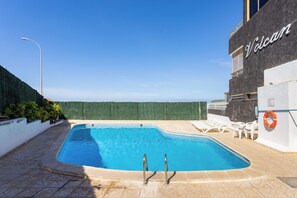 Outdoor pool - Seafront Apartment, balcony with ocean views of La Gomera and sunsets !!! (Guía de Isora)