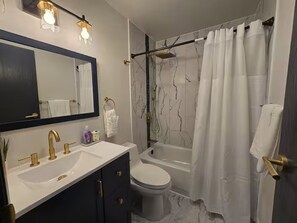 Hair dryer, towels, soap, toilet paper