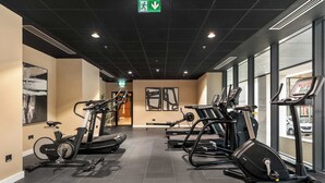 A gym with stationary bikes, treadmills, and elliptical machines. - Apex Executive Apartments- The Ironworks (Dublin)