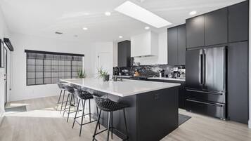 Coffee/tea maker, fridge, microwave, oven