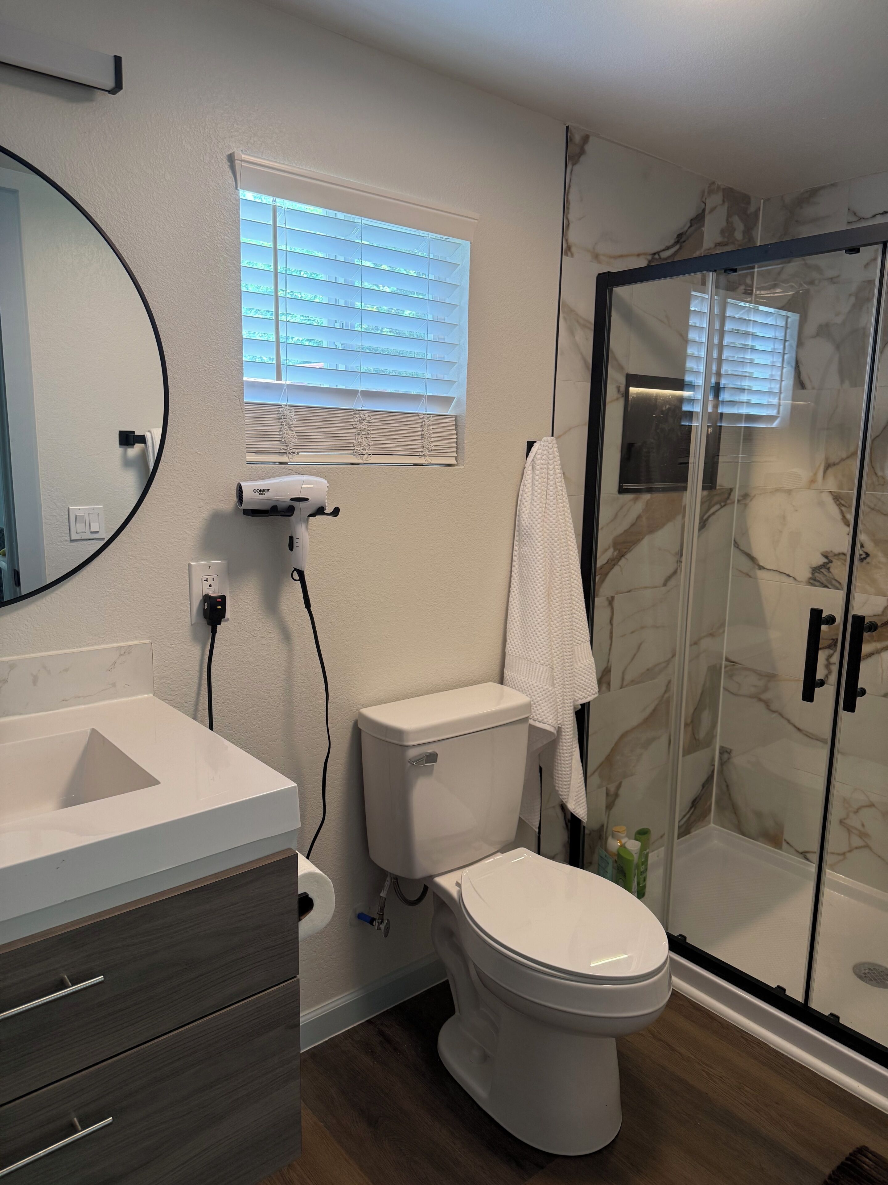 Shower, hair dryer, towels, soap