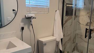 Shower, hair dryer, towels, soap