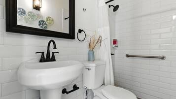Shower, hair dryer, towels, shampoo
