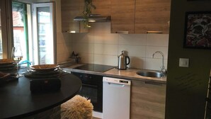 A modern kitchen with a dishwasher, stove, and sink. - LOVELY LITTLE NEST FOR UP TO 5 PEOPLE, PETS WELCOME (Nice)