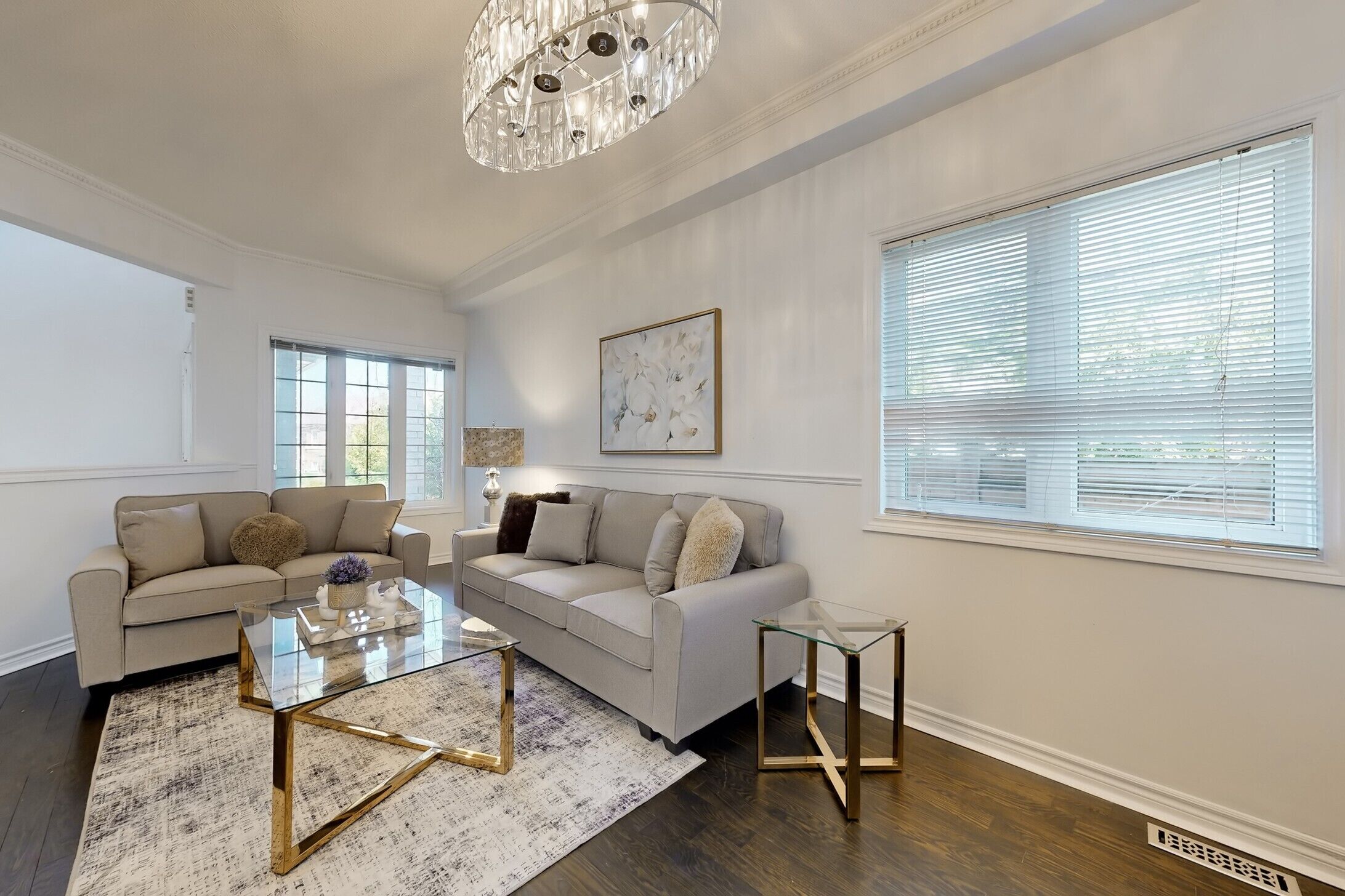Stylish interiors with chic gold accents and comfortable sofas.