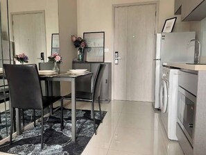 Dining room - Modern Condo in Khlong Toei Balcony, Gym, & Fast Wifi (Bangkok)