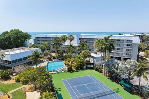 A hotel with a pool, tennis court, and ocean view. - Vitamin Sea at LaBrisa - Oceanfront View! (Key West)